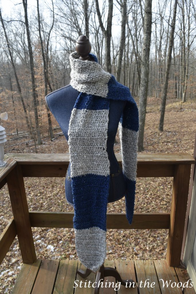 The Ravenclaw scarf wrapped like usually worn