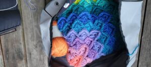 the insert inside the yarn tote with a blanket over the top of the insert