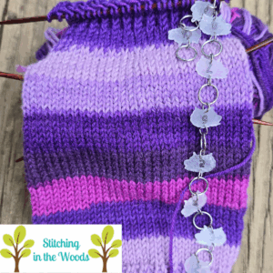 May monthly craft report socks progress, has a picture of a sock in progress on DPNs with a hanging row counter